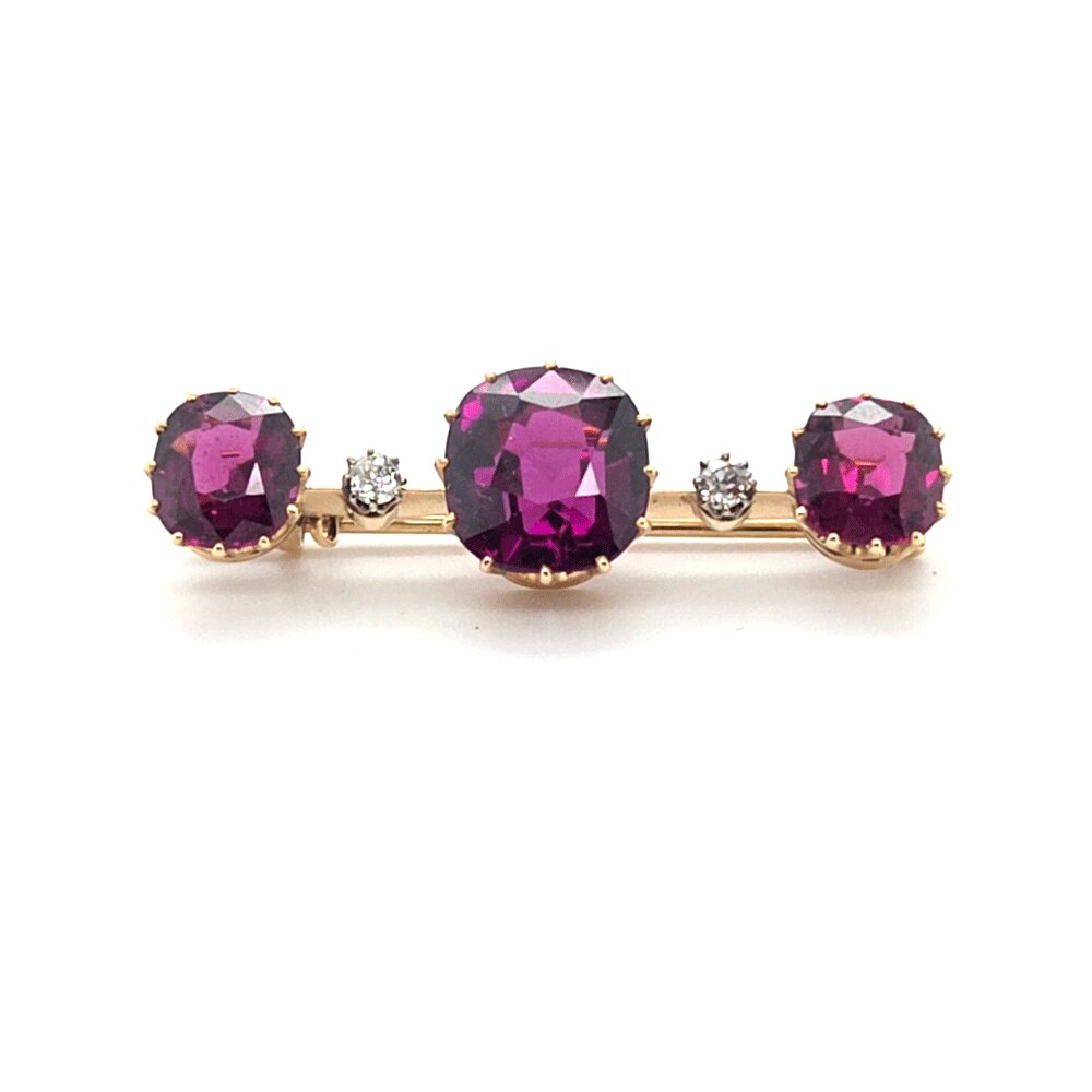 Gouden staafbroche met edelstenen en diamant